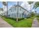 Inviting two-story townhouse featuring neat landscaping, mature palms, and a clean, modern color palette at 1312 Kelridge Pl, Brandon, FL 33511