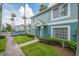 Townhouse with attractive landscaping, with close proximity to parking and mature palm trees at 1312 Kelridge Pl, Brandon, FL 33511