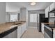 Open kitchen view features stainless appliances and granite countertops at 1312 Kelridge Pl, Brandon, FL 33511