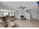 Open-concept living space with modern tile flooring, comfortable seating, and plenty of natural light at 1312 Kelridge Pl, Brandon, FL 33511