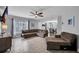 Inviting living room with comfortable sectional, large windows, and an open flow to the dining area at 1312 Kelridge Pl, Brandon, FL 33511