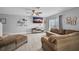 Bright living room with neutral tones, featuring wood-look tile floors and contemporary decor at 1312 Kelridge Pl, Brandon, FL 33511