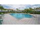 Community pool with tables and chairs, manicured hedges, and well maintained community buildings at 1312 Kelridge Pl, Brandon, FL 33511