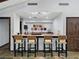 Resident lounge with a bar area with seating, decor, a sink, granite countertops, and track lighting at 13285 Arbor Pointe Cir # 202, Tampa, FL 33617