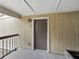 Close-up of unit 202 showcasing a front door, exterior light fixture, and building color scheme at 13285 Arbor Pointe Cir # 202, Tampa, FL 33617