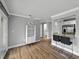 Bright and open living space with modern tile floors, seating at the kitchen bar, and a slider to the outdoor patio at 13285 Arbor Pointe Cir # 202, Tampa, FL 33617