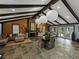 Resident lounge area featuring wood-beamed ceilings, slate flooring, a fireplace, and dining area at 13285 Arbor Pointe Cir # 202, Tampa, FL 33617