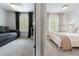 Two bedrooms showcase windows with shutters, comfortable beds, and ceiling fans at 14135 Stowbridge Ave, Tampa, FL 33626