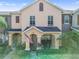 Charming two-story home with manicured lawn and inviting front porch with rocking chairs at 14135 Stowbridge Ave, Tampa, FL 33626