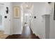 Hallway featuring wood flooring, recessed lighting, and an arched entryway at 14135 Stowbridge Ave, Tampa, FL 33626
