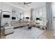 Bright living room featuring sophisticated decor and comfortable seating with ample natural light at 14135 Stowbridge Ave, Tampa, FL 33626