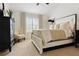 Bright main bedroom with natural light, neutral tones, and stylish decor at 14135 Stowbridge Ave, Tampa, FL 33626