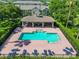 Aerial view of a community pool area with lounge chairs and shaded pavilion at 14135 Stowbridge Ave, Tampa, FL 33626
