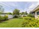Expansive backyard with lush landscaping and a well-manicured lawn, providing a tranquil and inviting space for outdoor living at 1441 S Hercules Ave, Clearwater, FL 33764