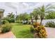Spacious backyard with lush landscaping, brick pavers, and privacy fence at 1441 S Hercules Ave, Clearwater, FL 33764