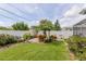 Well-maintained backyard with a beautiful garden and a manicured lawn, offering a private and inviting space for outdoor enjoyment at 1441 S Hercules Ave, Clearwater, FL 33764