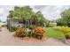 Brick paver walkway to screen room with tropical landscaping at 1441 S Hercules Ave, Clearwater, FL 33764