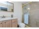 Bright bathroom with glass shower, light wood vanity, and a clean, modern design at 1441 S Hercules Ave, Clearwater, FL 33764