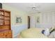 The cozy bedroom has a ceiling fan and closet at 1441 S Hercules Ave, Clearwater, FL 33764