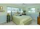 This bedroom features two windows, soft paint colors and neutral carpet at 1441 S Hercules Ave, Clearwater, FL 33764