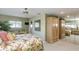 Comfortable bedroom with large mirrored closet, ceiling fan, and a green-themed interior at 1441 S Hercules Ave, Clearwater, FL 33764