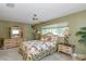 Comfortable bedroom with light-wood furniture, neutral carpet, and a view of the outdoors at 1441 S Hercules Ave, Clearwater, FL 33764