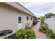 Exterior backyard view with white privacy fence, brick pavers and tropical foliage at 1441 S Hercules Ave, Clearwater, FL 33764