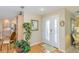 Welcoming foyer featuring hardwood floors and a view into the kitchen at 1441 S Hercules Ave, Clearwater, FL 33764