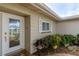 Inviting front entrance with a decorative glass door and well-kept landscaping at 1441 S Hercules Ave, Clearwater, FL 33764