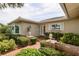 Welcoming front entrance featuring a brick path, manicured shrubbery and decorative outdoor lighting at 1441 S Hercules Ave, Clearwater, FL 33764