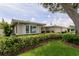 Charming single-story home with well-manicured shrubbery and a neutral color palette at 1441 S Hercules Ave, Clearwater, FL 33764