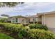 Charming home exterior with a well-manicured front yard and lush landscaping at 1441 S Hercules Ave, Clearwater, FL 33764