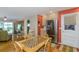 Bright kitchen and dining area with stainless steel refrigerator and access to the living area at 1441 S Hercules Ave, Clearwater, FL 33764