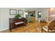 Comfortable living room showcasing hardwood floors and a view into adjacent living spaces at 1441 S Hercules Ave, Clearwater, FL 33764