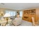 Bright living space showcasing a built-in bookcase and a window bench at 1441 S Hercules Ave, Clearwater, FL 33764