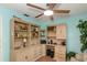 Inviting home office boasts custom built-ins and an abundance of natural light, perfect for remote work and focused productivity at 1441 S Hercules Ave, Clearwater, FL 33764