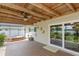 Covered patio with spa and view of backyard at 1441 S Hercules Ave, Clearwater, FL 33764