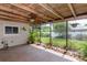 Screened patio with wood ceiling and view of backyard at 1441 S Hercules Ave, Clearwater, FL 33764
