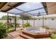 Screened spa on wood deck surrounded by landscaping at 1441 S Hercules Ave, Clearwater, FL 33764