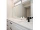 Modern bathroom featuring a sleek vanity with white cabinets, quartz countertop, and stylish fixtures at 14909 Oldgate Pl, Tampa, FL 33624