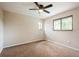 Bedroom featuring neutral walls, carpeted flooring, a ceiling fan, and natural lighting at 14909 Oldgate Pl, Tampa, FL 33624