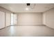 Spacious garage with ample storage space, featuring multiple doors and neutral paint at 14909 Oldgate Pl, Tampa, FL 33624