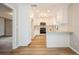 Modern kitchen with white cabinets, stainless steel appliances, granite countertops, and plenty of storage at 14909 Oldgate Pl, Tampa, FL 33624
