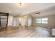 Open-concept living room featuring new floors, a modern staircase, and ample space for entertaining at 14909 Oldgate Pl, Tampa, FL 33624