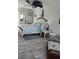 Bedroom with ceiling fan and coastal decor exudes relaxation at 1626 Sea Breeze Dr, Tarpon Springs, FL 34689
