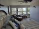 Bedroom with views of the water and a comfortable chair at 1626 Sea Breeze Dr, Tarpon Springs, FL 34689