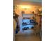 Walk-in closet with custom wood shelving and ample storage space at 1626 Sea Breeze Dr, Tarpon Springs, FL 34689