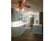 Spacious kitchen featuring custom blue cabinets and stainless steel appliances at 1626 Sea Breeze Dr, Tarpon Springs, FL 34689