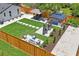 Aerial view of the backyard with a grill, dining table, swing set, and stepping stones at 1707 Solon Ave, Dunedin, FL 34698
