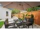 Backyard with patio dining area and fenced perimeter at 1707 Solon Ave, Dunedin, FL 34698